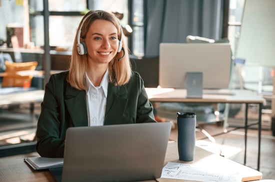 smiling-using-laptop-young-beautiful-woman-formal-clothes-is-working-office